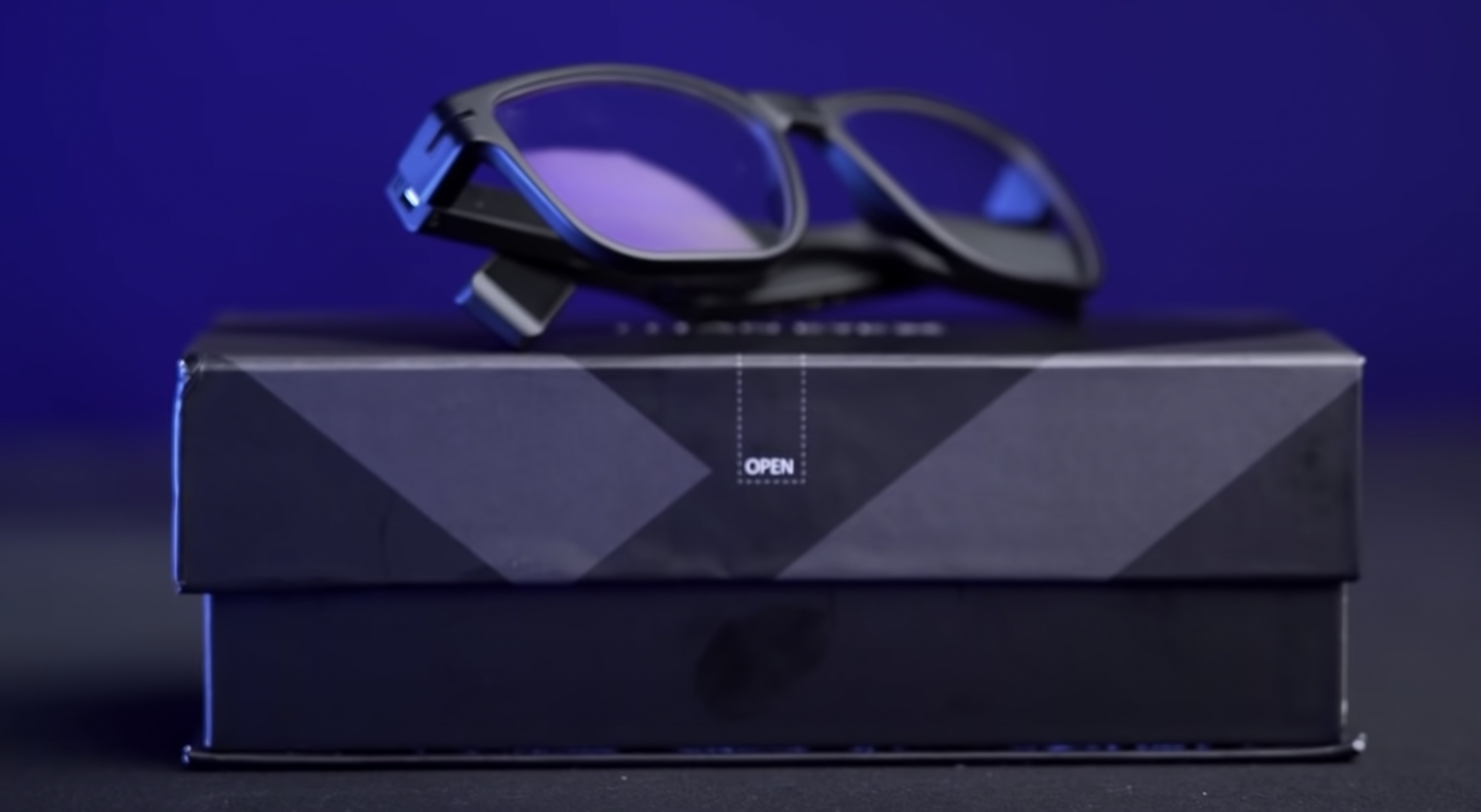 Titan EyeX glasses resting on the final product packaging